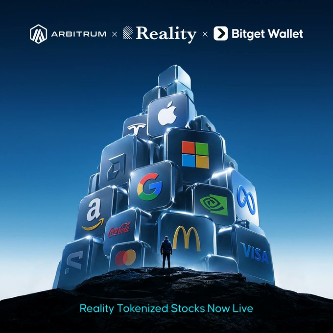 The image features a person standing before a towering structure made of glowing cube blocks displaying logos of major corporations (Apple, Microsoft, Google, Coca-Cola, Tesla, Visa, McDonald's, Mastercard, Amazon, Nvidia), with "ARBITRUM × Reality × Bitget Wallet" branded at the top and "Reality Tokenized Stocks Now Live" at the bottom—visually reinforcing the post's message about tokenized real-world assets becoming foundational building blocks of decentralized finance on Arbitrum.