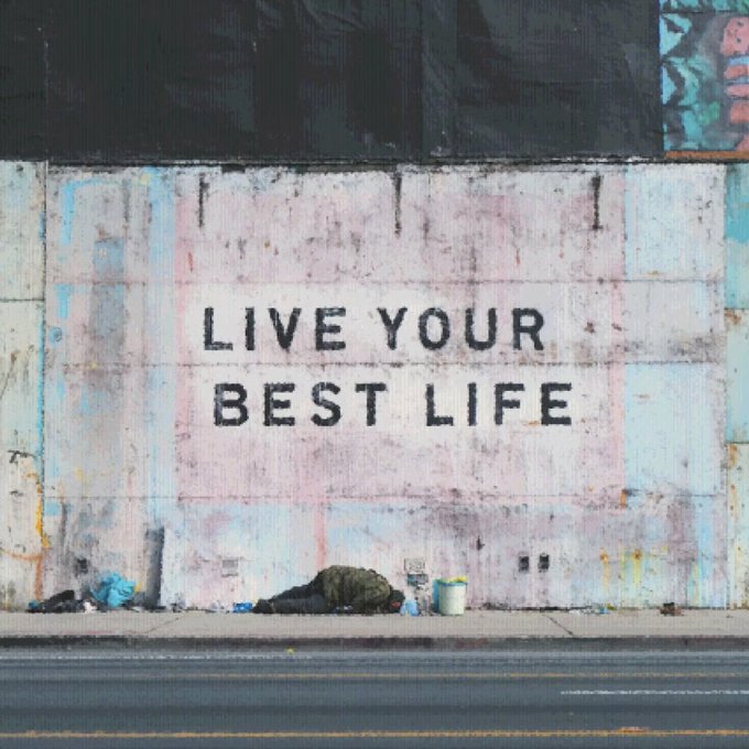 A weathered wall with the stenciled message 'LIVE YOUR BEST LIFE' above a person lying on the sidewalk.