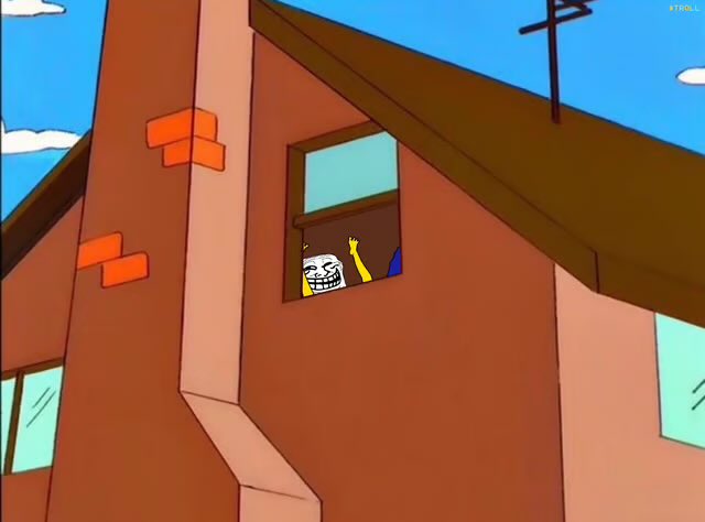 An animated scene from The Simpsons showing the 'Trollface' meme character waving from a window of a brown house with a sloped roof.