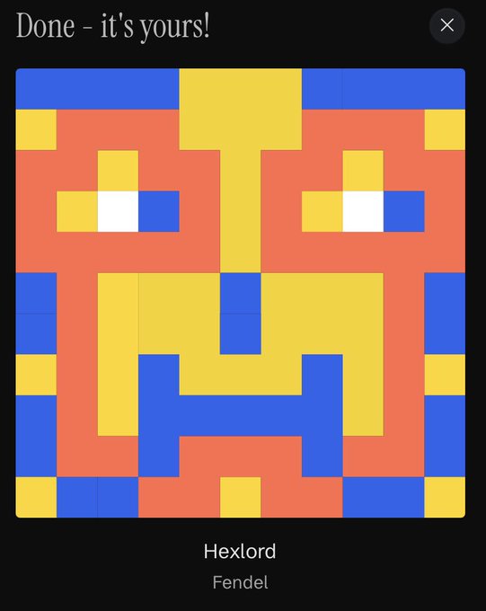 Screenshot of a completed pixel art piece titled 'Hexlord' by artist Fendel, featuring a colorful face pattern in blue, yellow, and red.