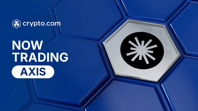 A Crypto.com promotional graphic announces, “NOW TRADING AXIS,” alongside a large AXIS Robotics token emblem. It promotes purchasing $AXIS in the Crypto.com App using USD, EUR, and other supported fiat currencies.
