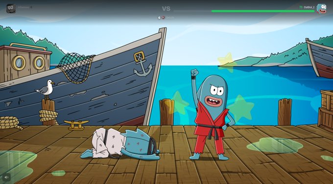 A screenshot from a 2D fighting video game showing a blue fish-like character in a red martial arts uniform celebrating victory over a defeated opponent on a wooden dock with a ship and seagull in the background.