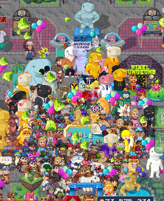 A densely crowded scene from the pixel art social game gdevelop, featuring numerous colorful avatars, gem icons, and balloons in a virtual space with a 'PIXEL MUSEUMS' sign.
