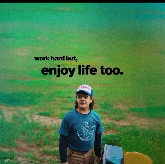 An inspirational graphic featuring the text 'work hard but, enjoy life too.' overlaid on a photo of a young man wearing a baseball cap and a graphic t-shirt standing in a grassy field.