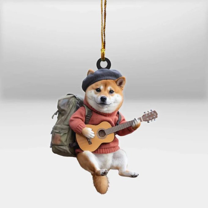 ikebana art piece features a brown and white shiba Inu dog, dressed as a musician with a backpack and guitar, against a gray background.