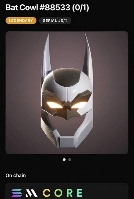 A digital collectible item screen showing a 'Bat Cowl #88533 (0/1)' labeled as 'LEGENDARY' and 'SERIAL #0/1', displayed on the 'CORE' platform with 'On chain' status.
