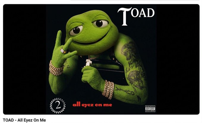The image is a meme-style parody of 2Pac's iconic "All Eyez On Me" album cover, featuring Pepe the Frog dressed as the rapper with gold chains, tattoos, and a cigar, with "TOAD" displayed prominently and "all eyez on me" written below. The caption "2" in the corner and "TOAD - All Eyez On Me" text support the post's mention of new $TOAD buyers, playfully framing meme coin investors as "gangsta" crypto enthusiasts.