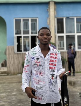 A young man proudly displays a white shirt covered in signatures and messages, with visible text including "B.Eng" and "400L," celebrating his recent graduation with a Bachelor of Engineering degree, as highlighted in the caption congratulating his achievement.