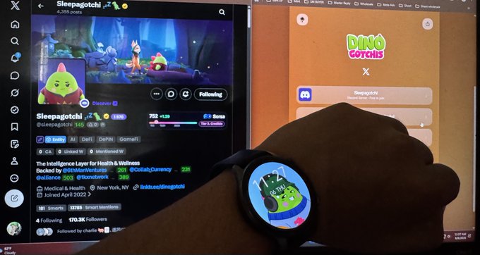 A person's wrist wearing a Samsung Galaxy Watch displaying a Sleepagotchi character, with the X (Twitter) profile of @Sleepagotchi visible on a laptop screen in the background, showing a collaboration with Dino Gotchis.