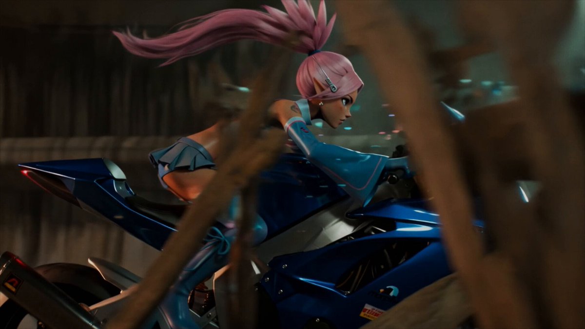 The image features a woman dressed in blue and pink clothing riding a motorcycle, which appears to be a character from Grok Imagine Video 1.5. The background of the image shows a tree branch with a "Higgsfield" logo on it, indicating that this is an advertisement for the video game. The post also mentions that the best model to push creative vision further and that the game has top-tier physics and faster generations.