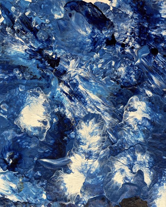 An abstract fluid art piece dominated by swirling patterns of deep blue and white paint, creating textured, marbled effects across the canvas.