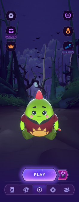 A mobile game screenshot featuring a cute green dragon-like creature in a dark forest setting with a 'PLAY' button and a 'Sleep Coach' countdown timer.
