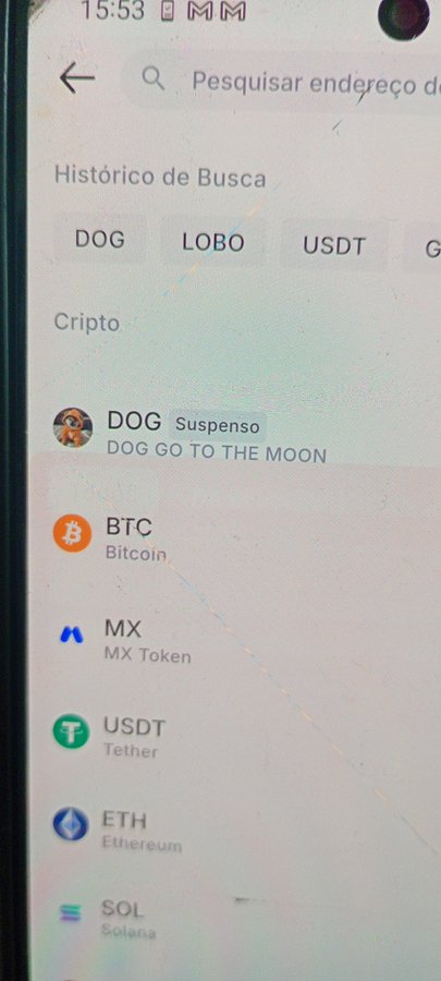 A photo of a crypto exchange app showing $DOG (DOG GO TO THE MOON) marked as "Suspenso" (Suspended) above a list of active cryptocurrencies including BTC, MX, USDT, ETH, and SOL, supporting the claim that $DOG has been held hostage for three straight days.