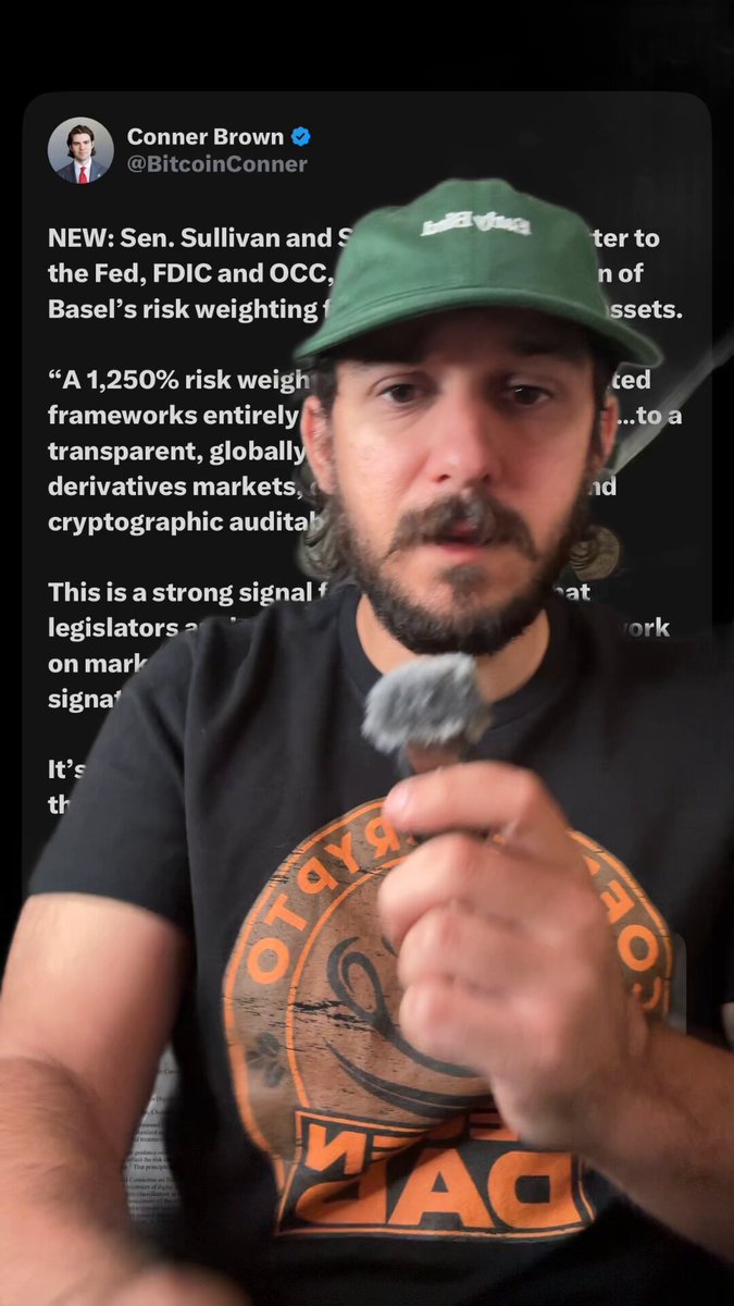 The image shows a man wearing an orange shirt eating with a fork near his mouth, possibly laughing or enjoying himself during a meal or video call. The caption below the photo highlights a recent tweet where the man is discussing the release of a new cryptocurrency, specifically Bitcoin Cash (BTC-USD), which could potentially double Bitcoin's worth within 12 months. This has caught the attention of both casual observers and people who are familiar with Bitcoin currency, including a former banker named Scott Sullivan. The post seems to be a part of an ongoing conversation about the potential impact of the release of the new cryptocurrency on the Bitcoin community.