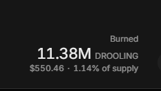 A dark screen showing a token burn metric: '11.38M Burned DROOLING' at $550.46, representing 1.14% of supply.