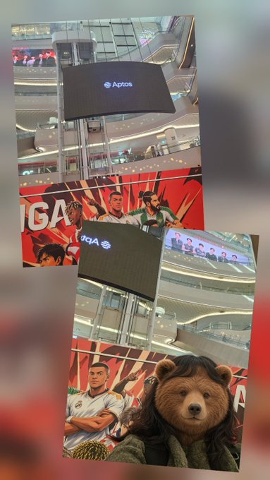 A collage shows a teddy bear character with long brown hair posing inside a shopping mall with anime soccer posters, with screens displaying the Aptos logo and 'Aptos' text.
