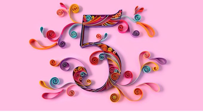 The image showcases a vibrant, decorative number "5" crafted from colorful quilled paper swirls and curling ribbons in hues of pink, orange, yellow, blue, and purple, set against a soft pink background—visually celebrating the artist's milestone of five years in NFT art.