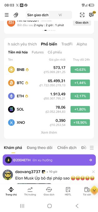 A cryptocurrency trading app screenshot in Vietnamese showing market prices for BNB ($573.17), BTC ($65,499.31), ETH ($1,913.49), SOL ($78.06), and XNO ($0.390) with various percentage changes.