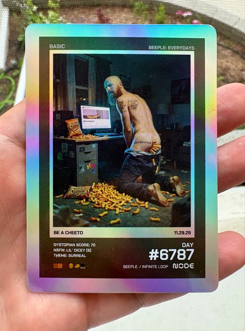 This image is representing a card metaphorically referring to "Beeple," a digital artist. It is not representing any real-world scenario. The card is labeled as part of the "#6787" series, which may be a NFT (non-fungible token) collection related to digital art. It is not equivalent to holding a physical card for a collectible like the Pokémon cards. No personal information relating to the time the image is being commented upon is available to fill in the article.