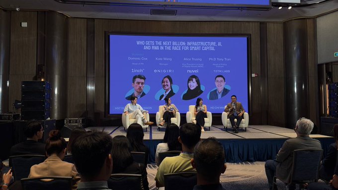 A panel discussion event titled 'Who Gets the Next Billion: Infrastructure, AI and Web3 in the Race for Smart Capital' featuring speakers Dominic Cox, Kate Wang, Alice Truong, and Ph.D Tony Tran on stage before an audience.