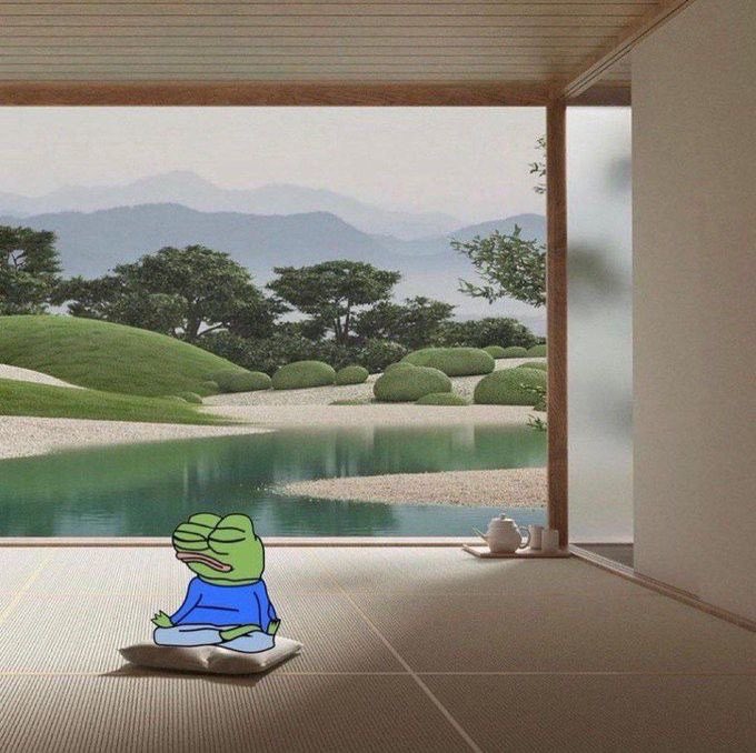 An image showing a meditating Pepe the Frog sitting on a cushion inside a traditional Japanese room with tatami mats, looking out at a serene zen garden with a pond and mountains.