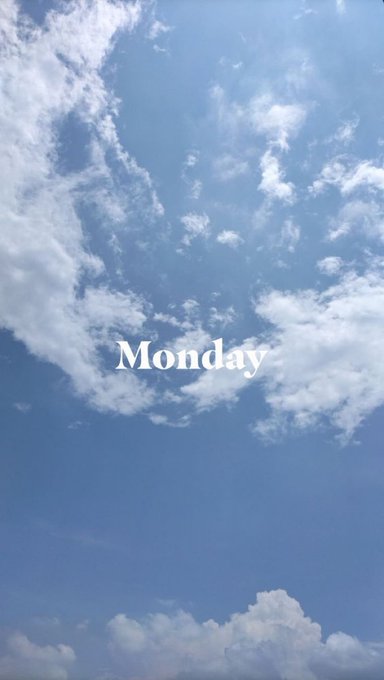 A blue sky filled with scattered white clouds with the word 'Monday' written in white text in the center.