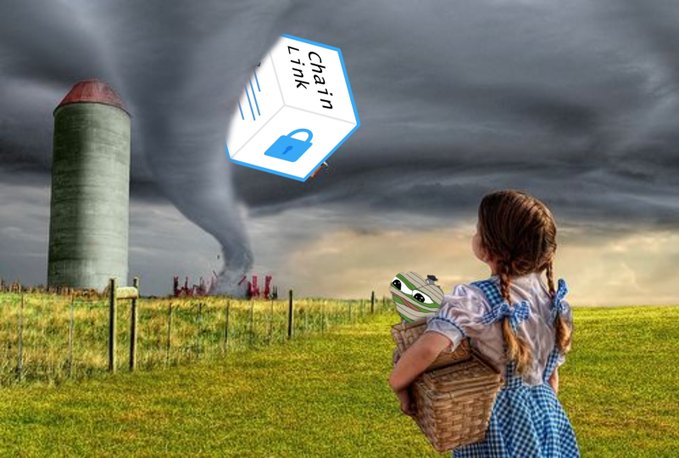 A digitally composited image shows a girl resembling Dorothy from The Wizard of Oz with a basket and Toto, watching a tornado over a farm, with a 'Chain Link' lock logo superimposed in the sky.