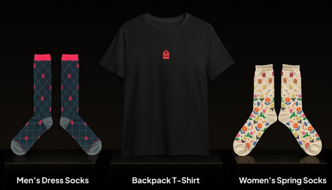 A product display features three items against a black background labeled 'Men's Dress Socks', a 'Backpack T-Shirt' with a red padlock logo, and 'Women's Spring Socks'.