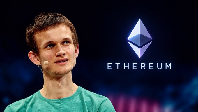 Vitalik Buterin, creator of Ethereum, pictured speaking at an event with the Ethereum logo (a diamond-shaped symbol) displayed prominently next to him.