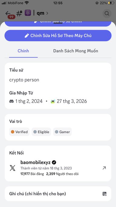 A mobile phone screenshot in Vietnamese displays a user profile for "qm" with the bio "crypto person," member since dates "1 thg 2, 2024 - 27 thg 3, 2026," and roles marked as Verified, Eligible, and Gamer, showing a connection to @baomobileyxz.