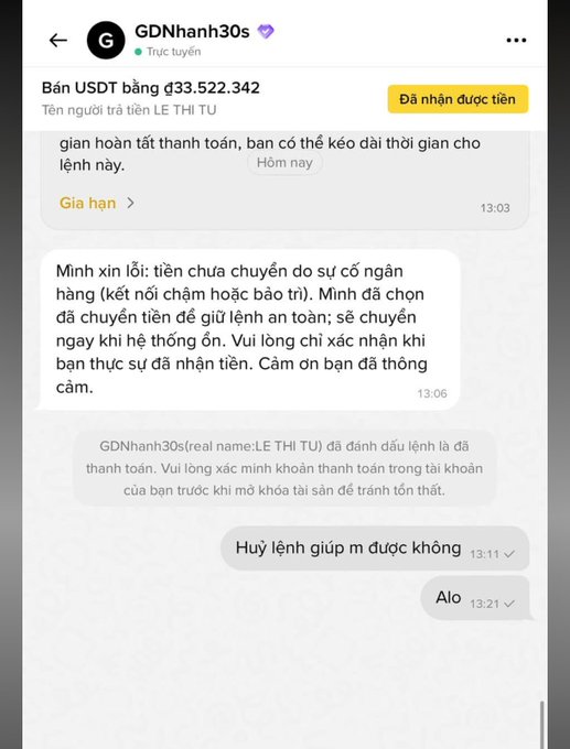A Vietnamese-language messaging app screenshot showing a USDT transaction for $33,522,342 from user 'GDNhanh30s' to 'LE THI TU', with messages apologizing for a system delay.