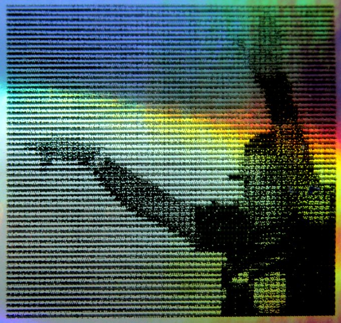 A heavily corrupted or distorted image of what appears to be a hand holding a rifle, displayed with scan lines, horizontal pixelation, and rainbow color shifting effects.