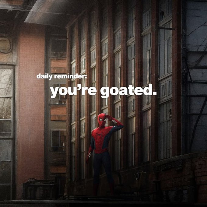 Spider-Man stands in an urban alleyway saluting, accompanied by the overlaid text 'daily reminder: you're goated.'