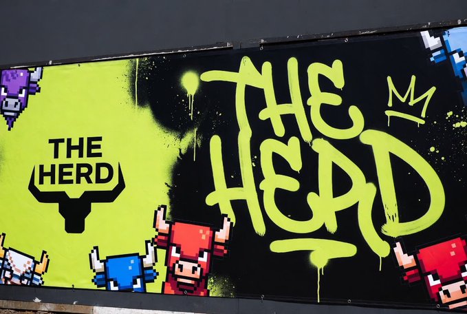 A vibrant graffiti-style billboard advertises "THE HERD" in bold yellow spray paint against a black background, featuring pixelated bull characters in purple, red, and blue. The promotion invites users to follow @HerdRH_ and @B33ofweb3 for a chance to win one of 10 spots in the Herd community.