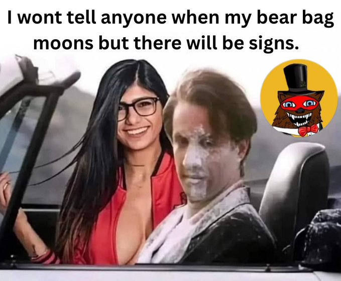 A meme featuring a woman's face photoshopped onto a scene from a car alongside a man's face, with a cartoon bear sticker, captioned 'I wont tell anyone when my bear bag moons but there will be signs.'