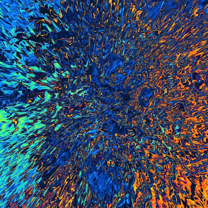 The image features a vibrant display of colors with a blue background that appears to be splattered or painted onto itself. The colors are predominantly blue, orange, and green, creating an abstract and visually striking effect. The image also contains text elements such as "GM! The “Shard” 1/1s are gone But there are still pieces to discover Three new generative open editions, now live on @objktcom 5 tez". This suggests that the image is a part of an ongoing creative process or project.