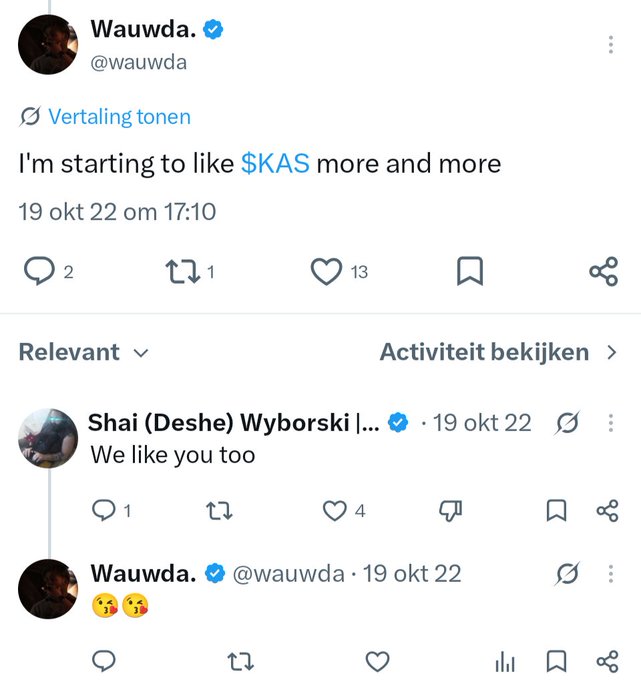 A Twitter screenshot showing a tweet from user "Wauwda." (@wauwda) saying "I'm starting to like $KAS more and more", with a reply from "Shai (Deshe) Wyborski" reading "We like you too".