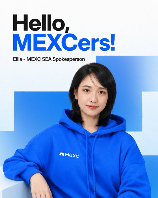 Ellia, MEXC's SEA Spokesperson, wears a blue MEXC-branded hoodie beneath a "Hello, MEXCers!" greeting, visually introducing herself to the community as mentioned in her post about her background in the crypto industry.