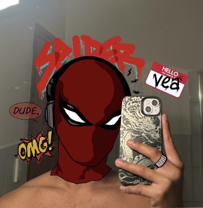 A mirror selfie features a red Spider-Man graphic filter over the person's face, along with comic-style text overlays reading 'SPIDER', 'HELLO MY NAME IS Nea', 'DUDE.', and 'OMG!'.