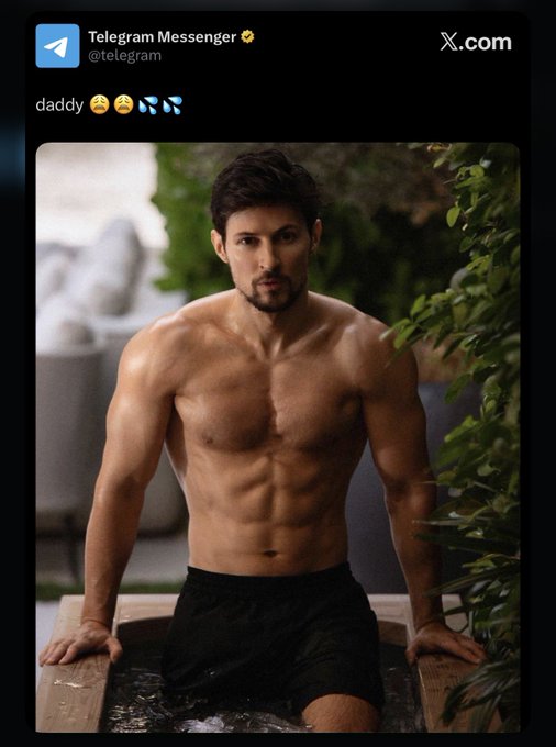 The image features a shirtless man posing with his arms crossed over his chest while standing in water. The photo has been shared on social media, where it was captioned "Telegram Messenger" and "x.com". This caption suggests that the man is sharing a moment from his life or an interesting event he experienced. The image also includes text about Telegram messenger and Gram messaging, which might be related to the post's context.