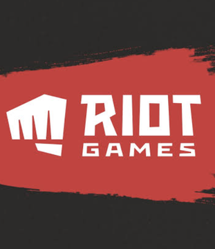 The Riot Games logo is displayed on a red paint brush stroke background, contrasting with the post about Riot Platforms (note: different companies share the "Riot" name) signing a $9.1 billion AI data center deal with Anthropic, causing $RIOT shares to surge over 20%.