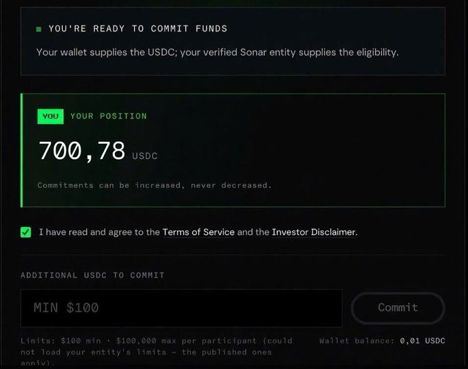 A digital interface displaying "YOU'RE READY TO COMMIT FUNDS" with a position of 700,78 USDC, including fields to commit additional USDC (minimum $100) and a checked box agreeing to the Terms of Service and Investor Disclaimer.