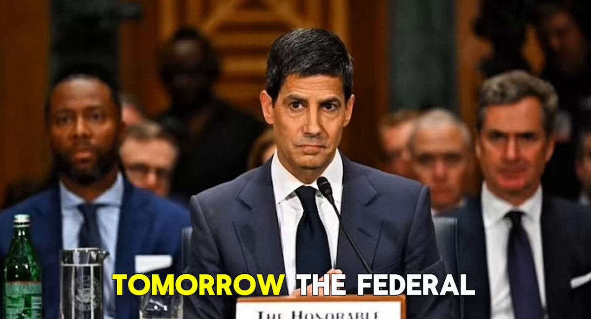 The image shows a man standing at a podium wearing a suit speaking in front of an audience that consists of other men also dressed in suits. The scene conveys the atmosphere of a formal event or gathering, such as a political speech or discussion taking place at a government or business meeting. The post on the image appears to be promotional material related to a specific event or product launch in finance or investment markets.