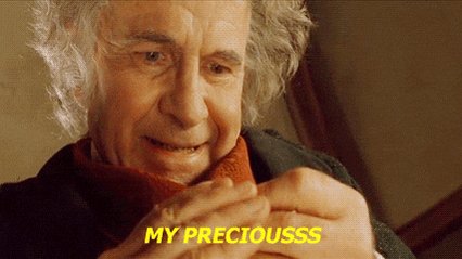 The image features an older man with white hair wearing a red scarf, smiling at the camera while looking down at his hands. The caption below the photo reads "My preciousss", which seems to be a reference to the Dogecoin exchange. This suggests that the image is related to the post about the Dogecoin exchange and its popularity among users.