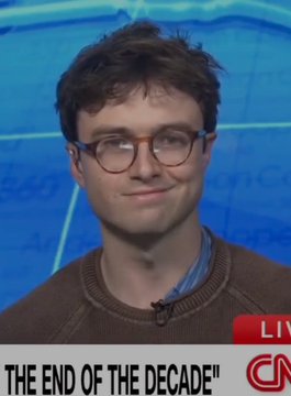 A news broadcast frame shows a young man with glasses, with the partial text "THE END OF THE DECADE" visible along with a CNN logo.