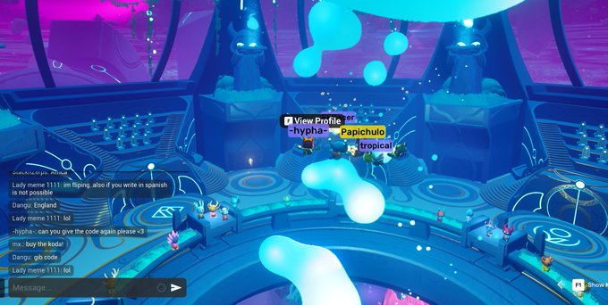 The image shows a video game scene with a character standing inside a temple, surrounded by blue and purple elements. The character's name tag reads "Papichulomeme" as they explore the temple. In the background, there are other characters present in the same temple setting. A post on social media is displayed at the bottom of the image, which mentions that the player has claimed a badge from the Koda Council III and is being recognized for their achievement.