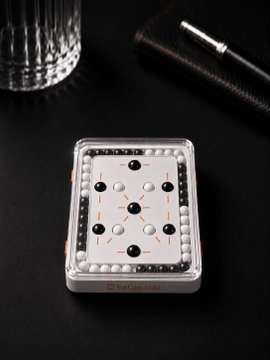 A BitCan hardware device sits on a black surface, generating cryptographic entropy through its internal array of marbles and pegs rather than dice rolls, as referenced in the post about avoiding manual randomness sources after the COLDCARD incident.