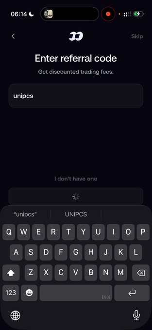 A mobile app screen titled "Enter referral code" with "Get discounted trading fees" subtitle, showing the code "unipcs" entered and a keyboard at the bottom.