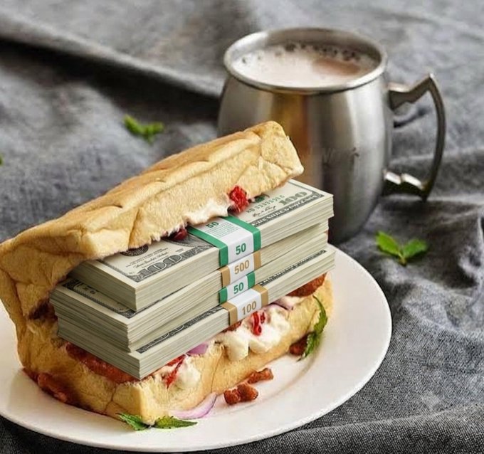 A sandwich filled with stacks of US dollar bills in $50 and $100 denominations, served on a plate next to a metal mug of coffee.