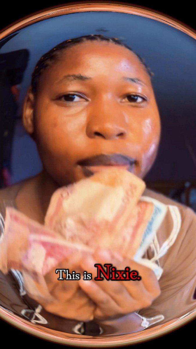 The image features a woman holding money in her hands, with the text "This is Nixie" written above her head. The focus of the image seems to be on the woman's hand holding the money rather than the actual content of the photo.